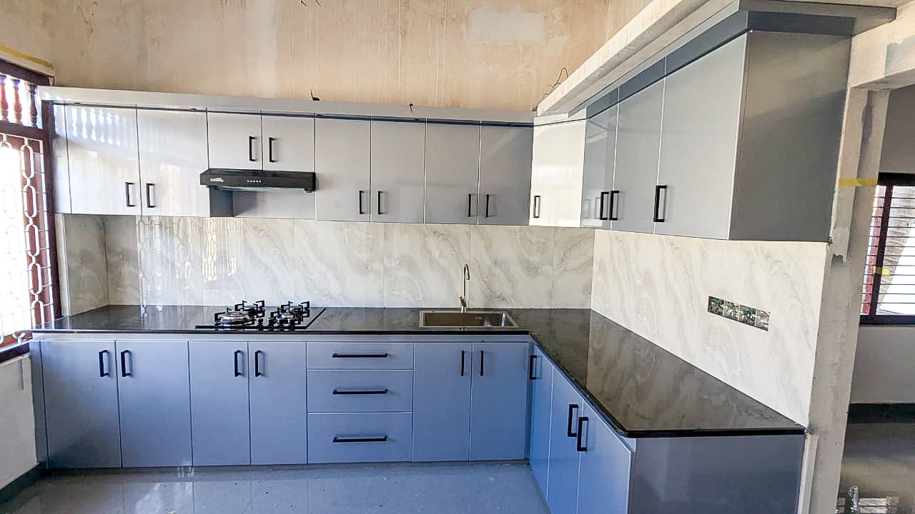 Custom built-in kitchen storage cupboards and worktop fitting